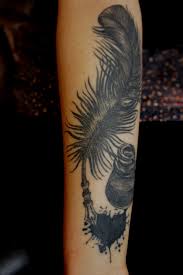 Black ink feather pen tattoo