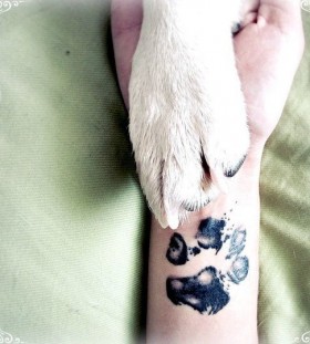 Black realistic dog's tattoo