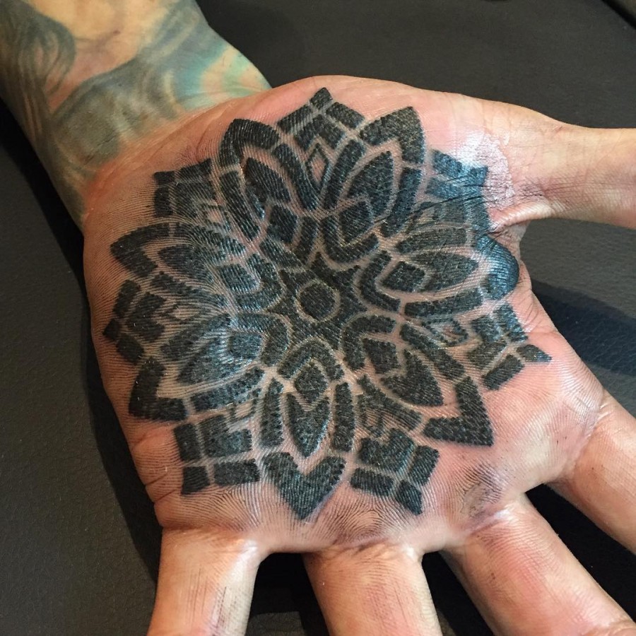 bold-hand-mandala-tattoo-by-briangeckleart