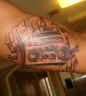 Boombox hip hop arm tattoo