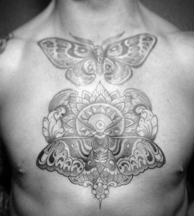 Buterflies chest tattoo by Pepe Vicio
