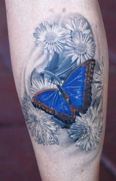 Butterfly and flowers tattoo by Phil Garcia