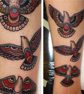 Colorful and black tribal bird tattoo