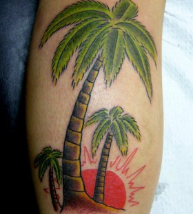 Coloured palm tree arm tattoo