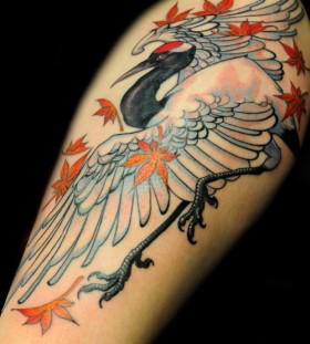 Crane and leaves tattoo