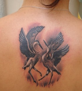 Dancing cranes back tattoo