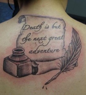 Feather pen and quote tattoo