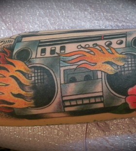 Flaming boombox and flower tattoo
