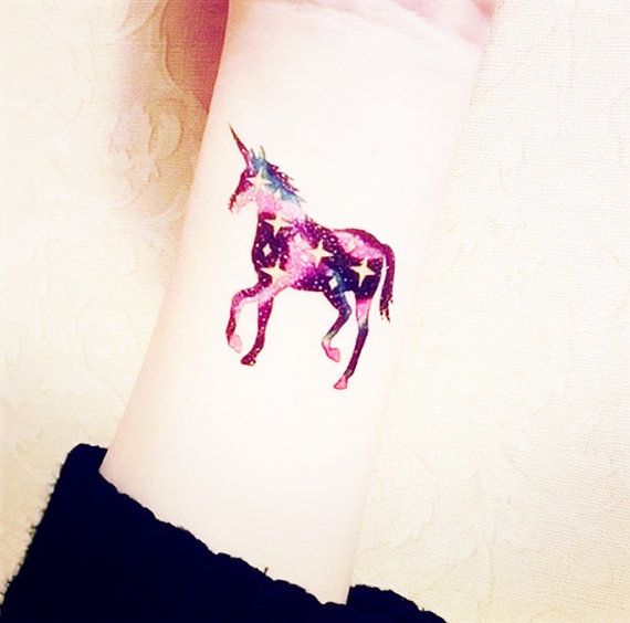 Galaxy style unicorn tattoo