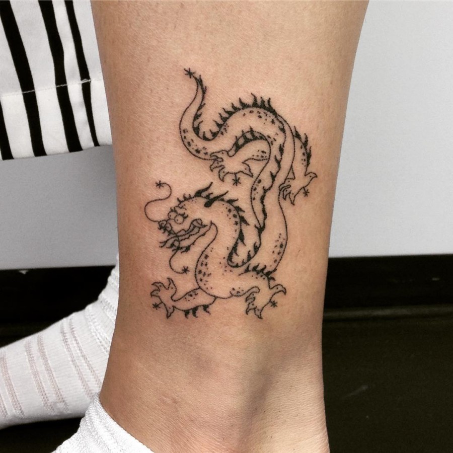 handpoked dragon tattoo by taticompton