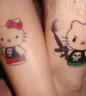 Hello kitty with guns tattoos