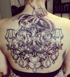 Incredible chandelier back tattoo