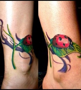 Laybug on a leaf ankle tattoo