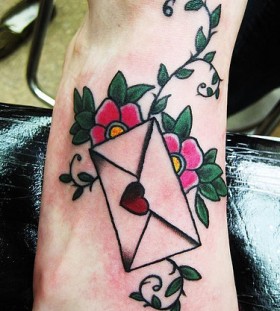 Lovely envelope and flowers foot tattoo