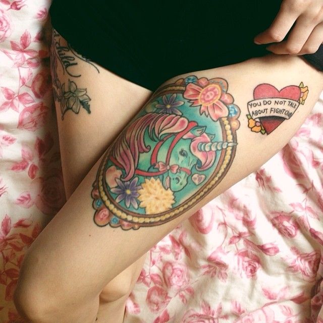 Lovely flowers unicorn tattoo