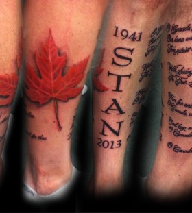 Maple leaf and quote tattoo