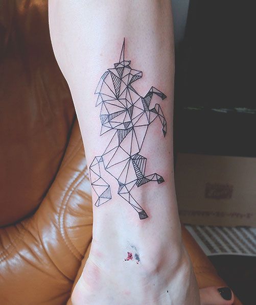 Origami style unicorn tattoo