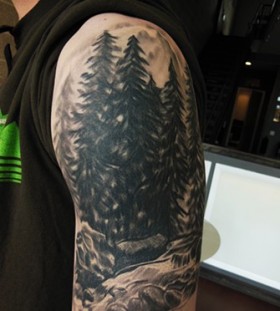 Pine trees arm tattoo