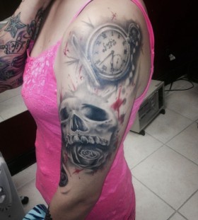 Pocket watch and skull tattoo