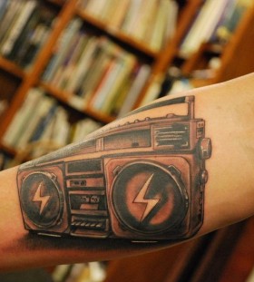 Realistic boombox arm tattoo