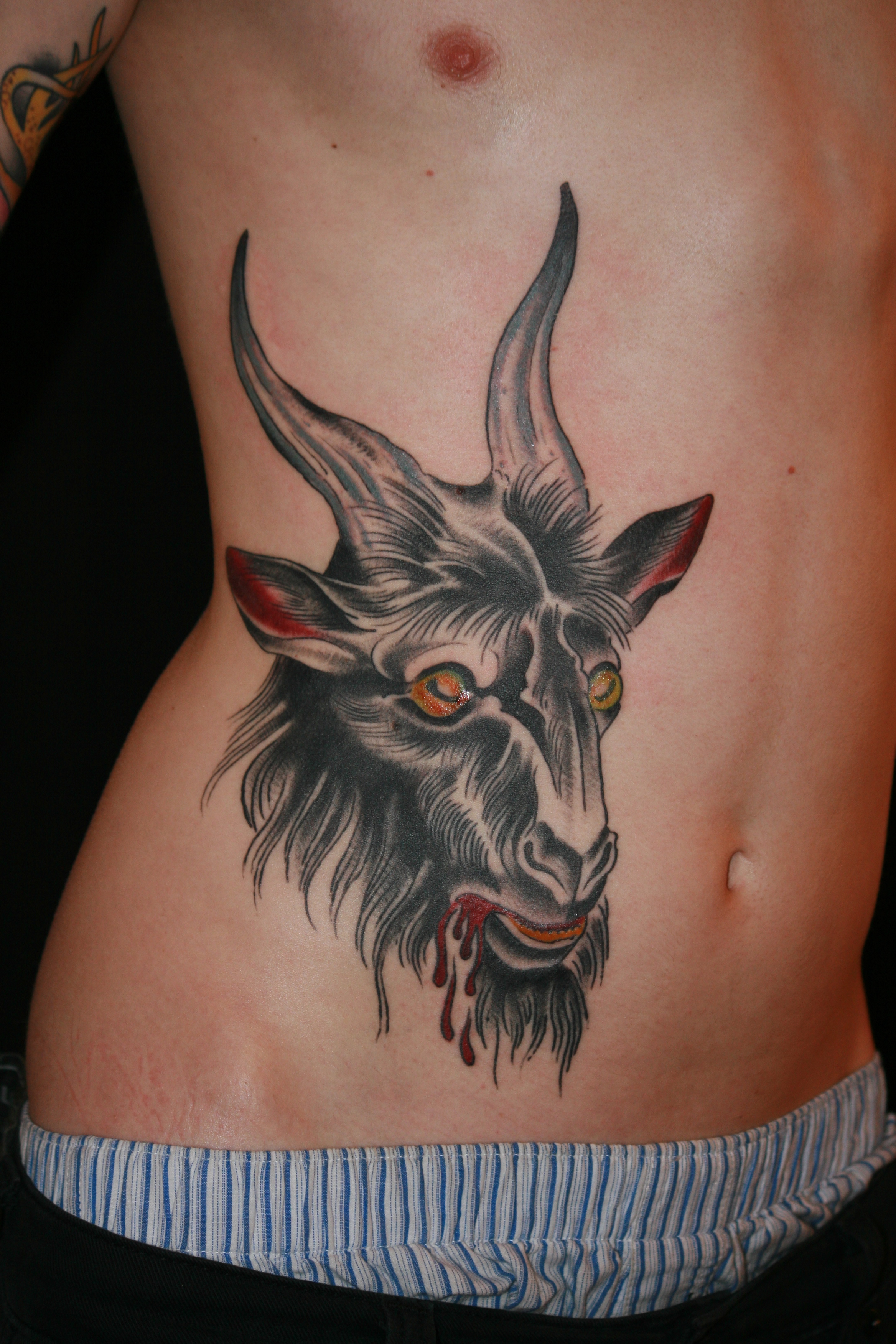 Scary bloody goat tattoo - TattooMagz