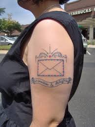 Simple envelope arm tattoo
