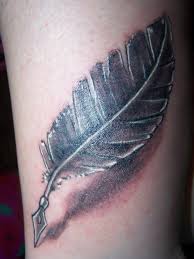 Simple feather pen tattoo