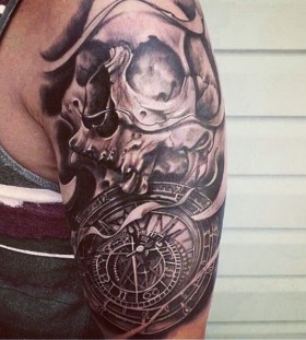 Skull and clock arm tattoo