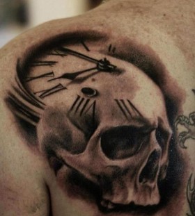 Skull clock back shoulder tattoo