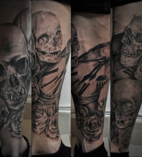 Skulls and clock tattoo