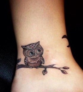 Small owl ankle tattoo