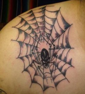 Spider web shoulder tattoo