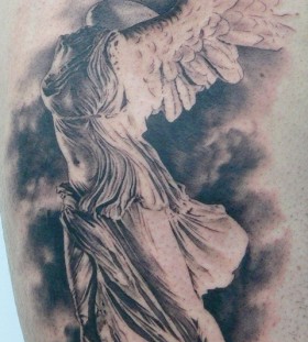Statue tattoo by Xavier Garcia Boix
