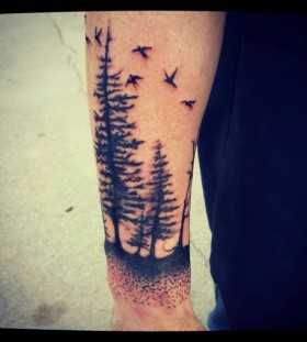 Stunning pine tree arm tattoo