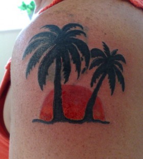 Sunset and palm tree tattoo