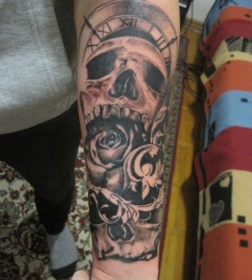 Sweet skull clock arm tattoo
