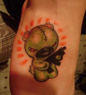Teddy with a gun tattoo