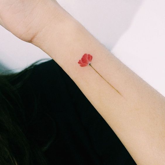 tiny poppy tattoo