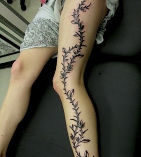 Tree branch leg tattoo