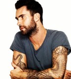 Adam Levine Flower and Wing Tattoo on Right Arm
