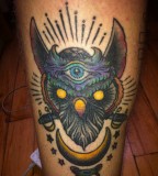 Head Of Totem Tattoo In Arm
