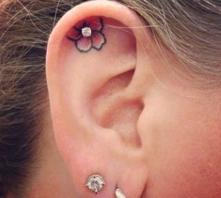 cute ear flower tattoo