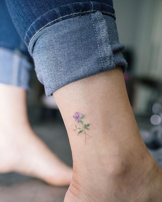 daintu blue flower tattoo