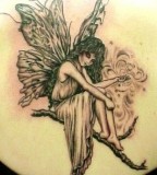 Cute Angel on Bough Tattoos