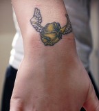 Cool Harry Potter Wings Symbol Tattoo on Upper Wrist