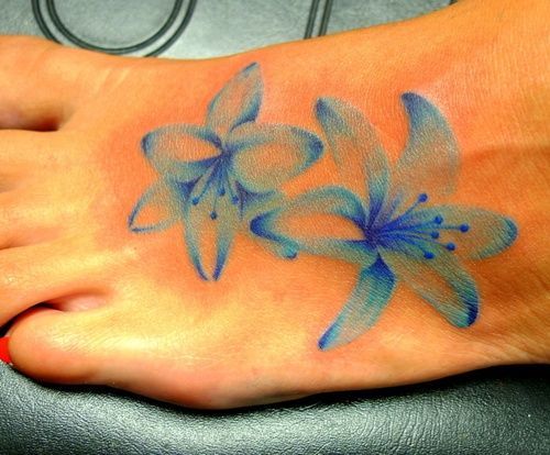 faded blue flower tattoo