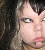 Funny Fat Emo Girl with Chic Tattoos at Face