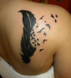 Women Back Feather into Birds Tattoo