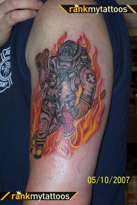 Firefighter Rescueing A Child Firefighter Tattoo