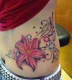 Lotus Flowers And Swirl Tattoo Lower Back